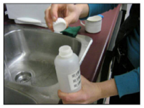 Unscrew cap from water sample bottle